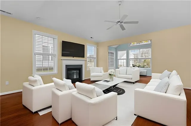 a living room with furniture fireplace and a flat screen tv