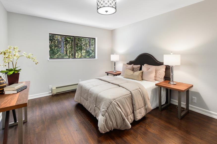 56 Big Tree Road Woodside, CA 94062 - Photo 12 of 31 a bedroom with a bed table and a chair