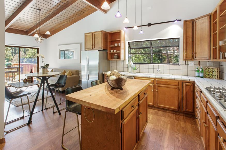 56 Big Tree Road Woodside, CA 94062 - Photo 20 of 31 a kitchen with a stove a sink and a refrigerator