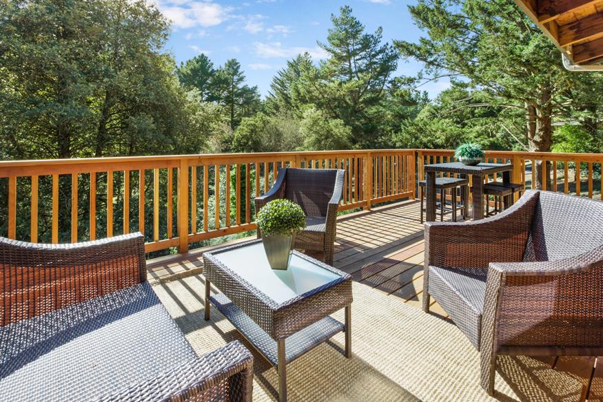 56 Big Tree Road Woodside, CA 94062 - Photo 21 of 31 a view of a chair and table on the deck