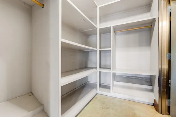 a view of an empty walk in closet