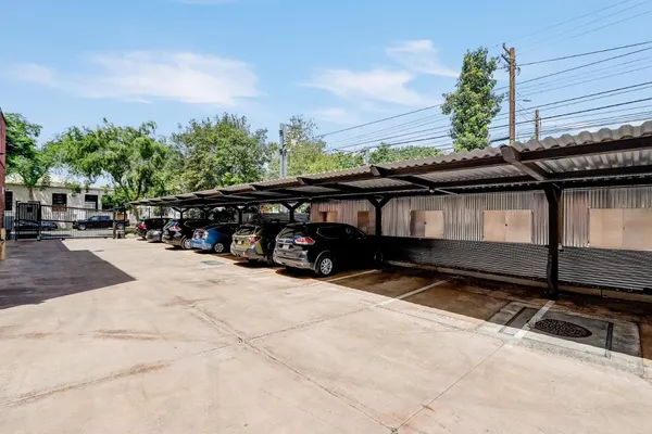 a view of a street with cars on road