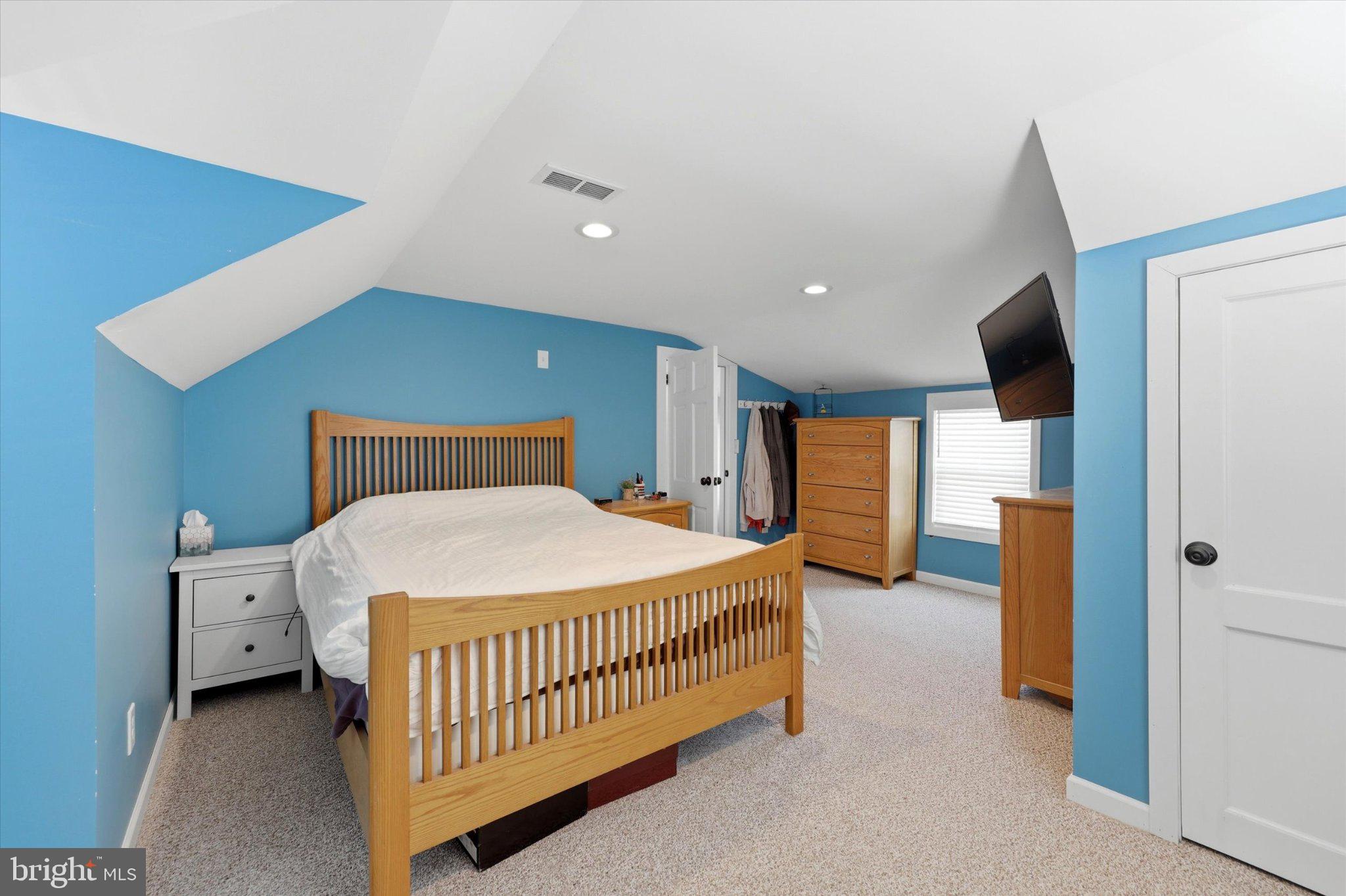 100 5th Street Brooklawn, NJ 08030 - Photo 14 of 23 Cozy blue-hued attic retreat.