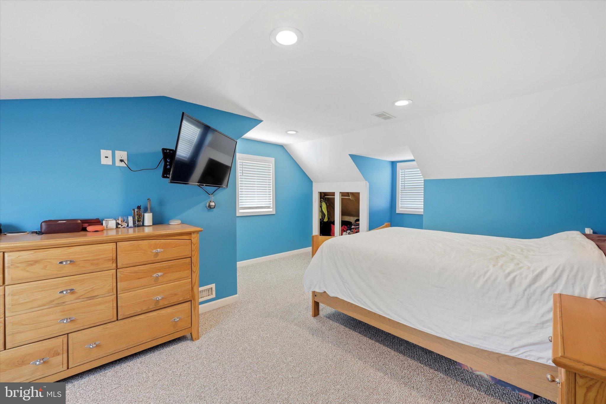 100 5th Street Brooklawn, NJ 08030 - Photo 15 of 23 Cozy attic retreat with vibrant walls.