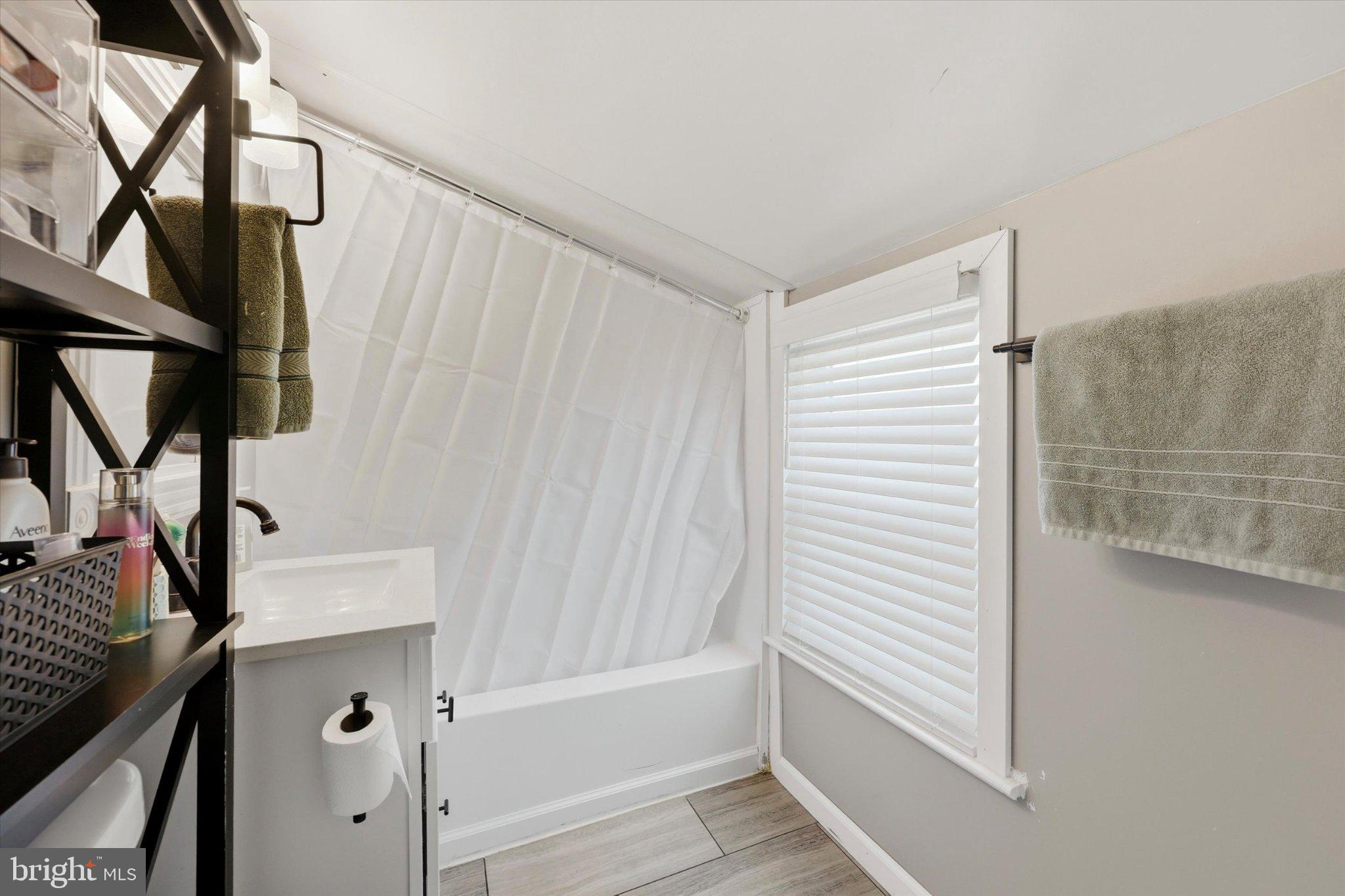 100 5th Street Brooklawn, NJ 08030 - Photo 18 of 23 Bright and airy bathroom retreat.
