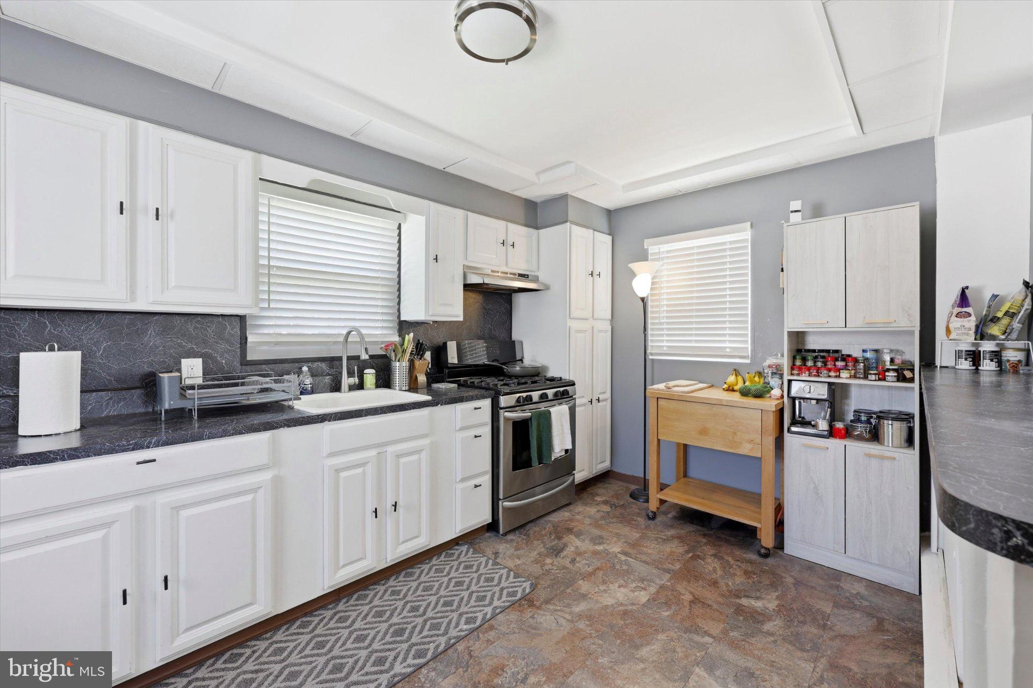 100 5th Street Brooklawn, NJ 08030 - Photo 7 of 23 Modern kitchen with sleek finishes.