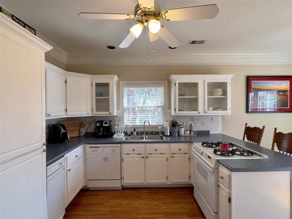 11 Stonegable Drive Northwest Rome, GA 30165 - Photo 11 of 27 a kitchen with a sink stove and cabinets