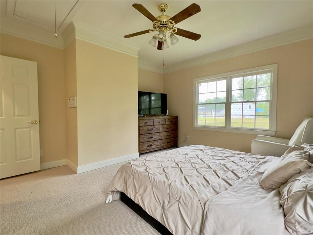 11 Stonegable Drive Northwest Rome, GA 30165 - Photo 17 of 27 a bedroom with a bed ceiling fan and a window