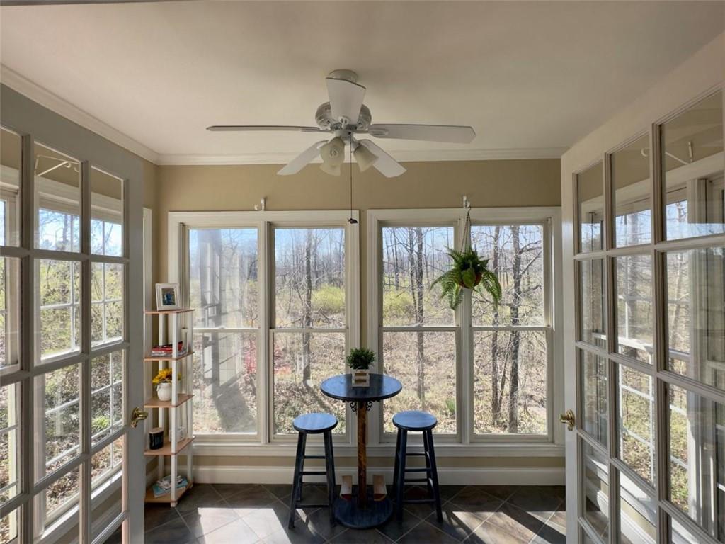 11 Stonegable Drive Northwest Rome, GA 30165 - Photo 26 of 27 a living room with furniture and a floor to ceiling window