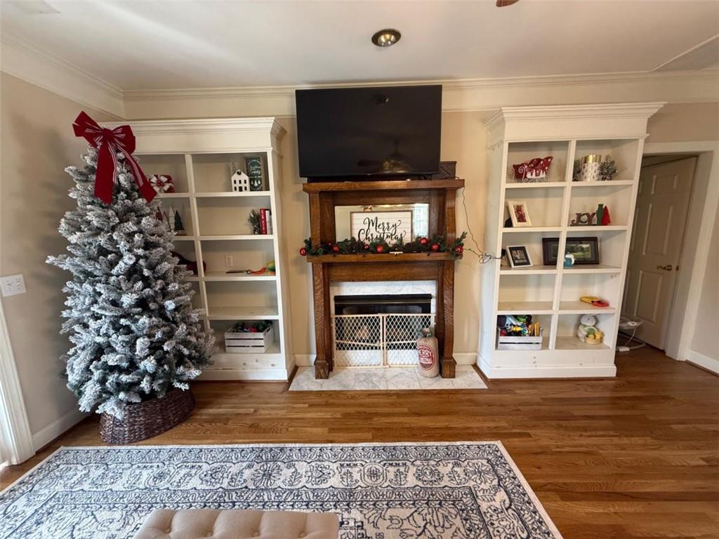 11 Stonegable Drive Northwest Rome, GA 30165 - Photo 9 of 27 a living room with a flat screen tv and a fireplace