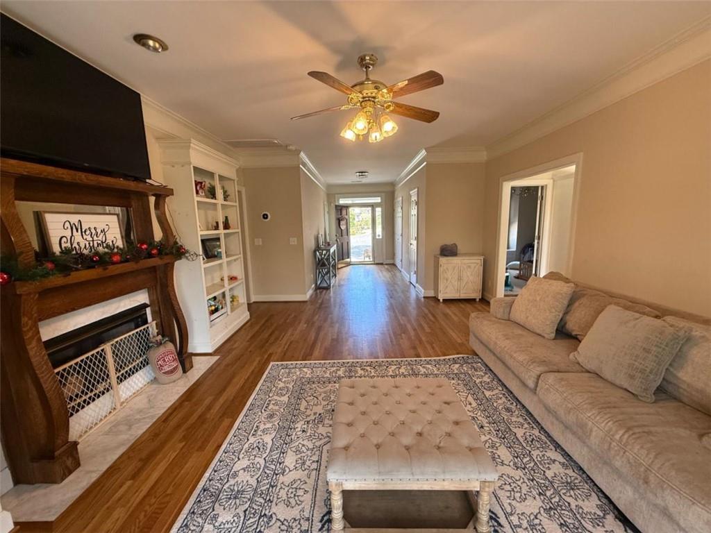 11 Stonegable Drive Northwest Rome, GA 30165 - Photo 10 of 27 a living room with furniture and a flat screen tv