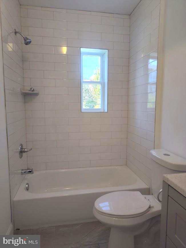 4230 6th Street Southeast, Unit 1 Washington, DC 20032 - Photo 13 of 25 a bathroom with a toilet and a tub