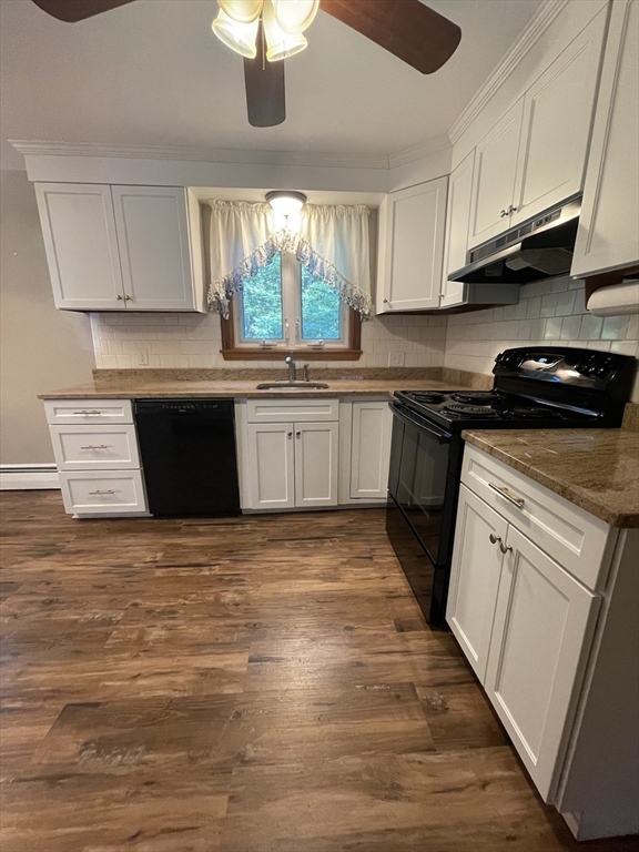 7 Albert Street Billerica, MA 01821 - Photo 11 of 33 a kitchen with stainless steel appliances granite countertop a stove a sink and white cabinets