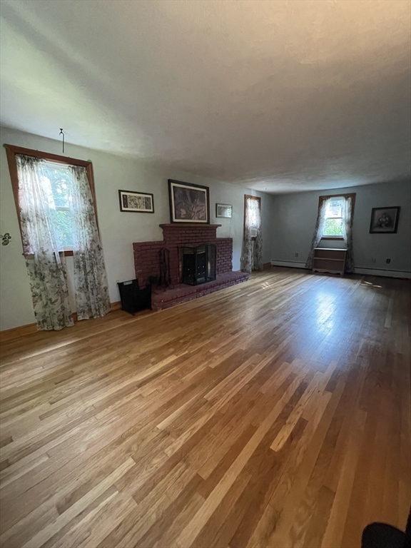 7 Albert Street Billerica, MA 01821 - Photo 17 of 33 a view of a livingroom with furniture window and wooden floor