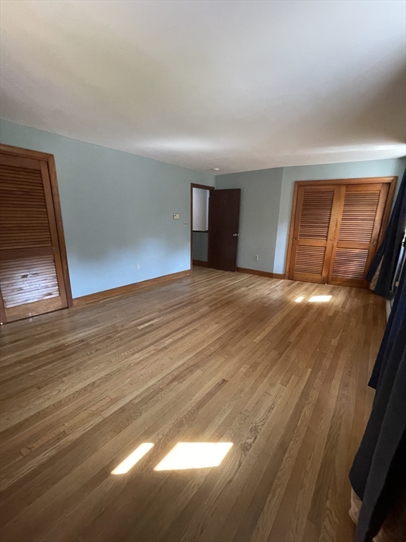7 Albert Street Billerica, MA 01821 - Photo 20 of 33 a view of empty room with wooden floor