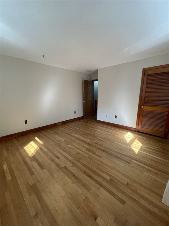 7 Albert Street Billerica, MA 01821 - Photo 22 of 33 a view of room with wooden floor
