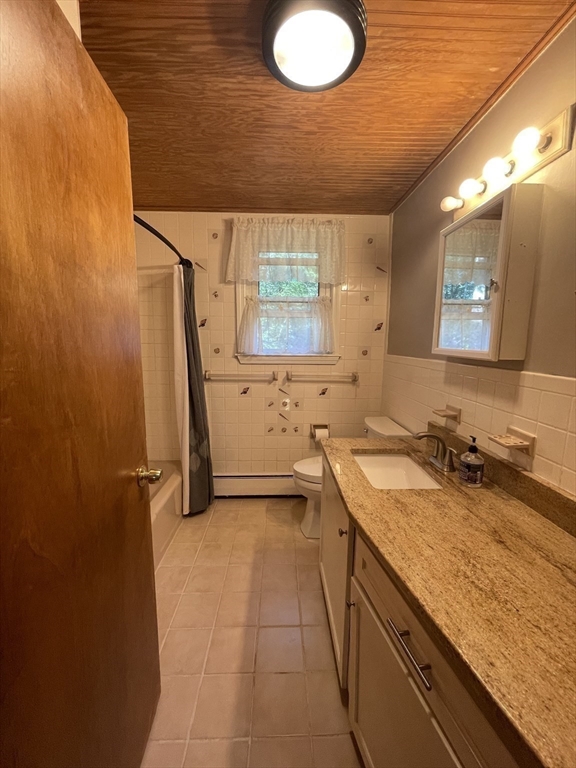 7 Albert Street Billerica, MA 01821 - Photo 25 of 33 a bathroom with a sink and a mirror