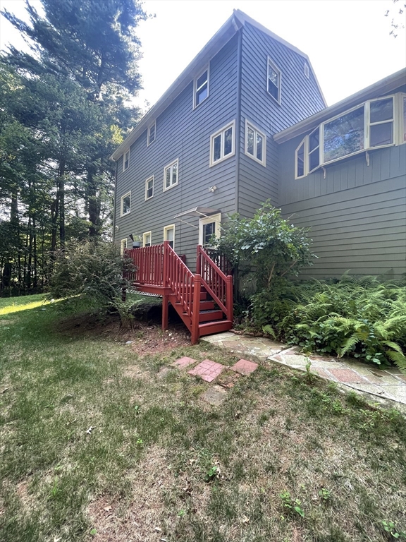 7 Albert Street Billerica, MA 01821 - Photo 3 of 33 a view of a brick house with a yard