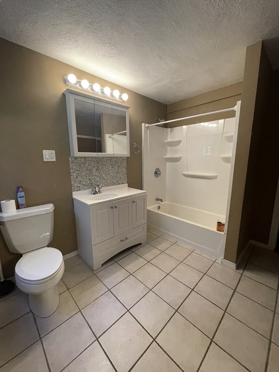 7 Albert Street Billerica, MA 01821 - Photo 31 of 33 a bathroom with a sink toilet and mirror