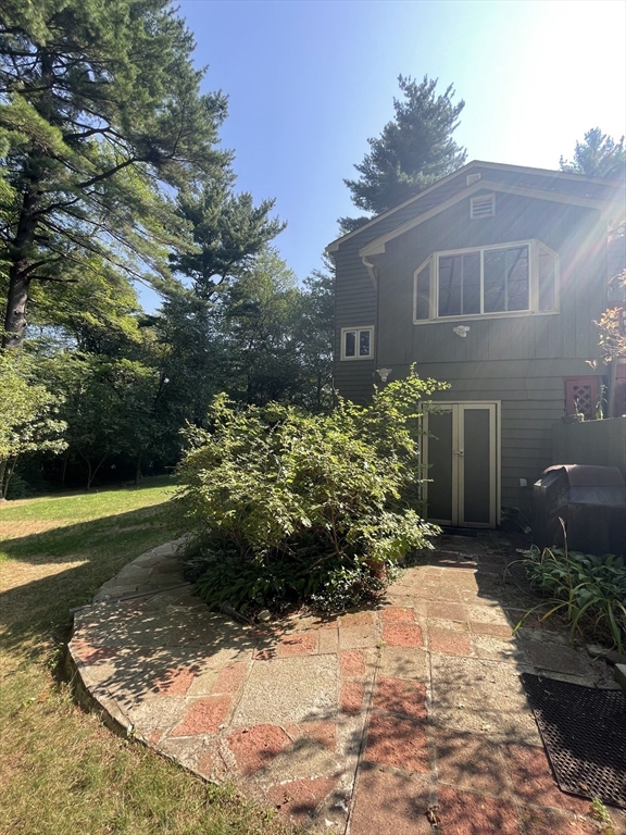 7 Albert Street Billerica, MA 01821 - Photo 4 of 33 a backyard of a house with a yard and outdoor seating