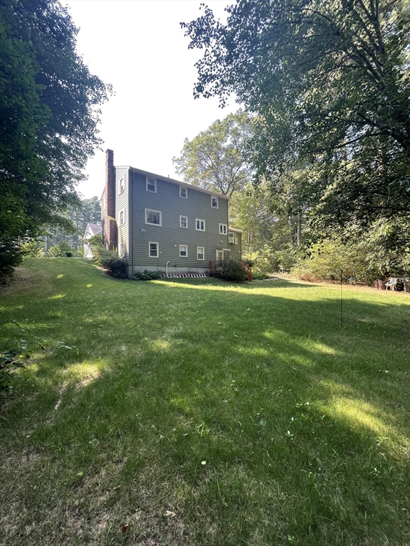 7 Albert Street Billerica, MA 01821 - Photo 5 of 33 a backyard of a house with lots of green space
