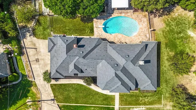 a view of a lake with a house in the background