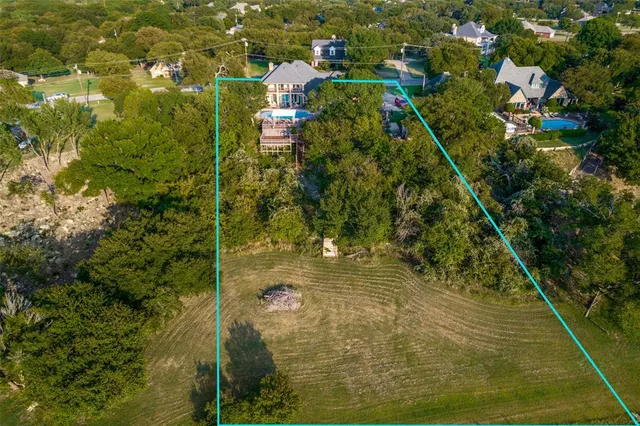an aerial view of a house with a lake view