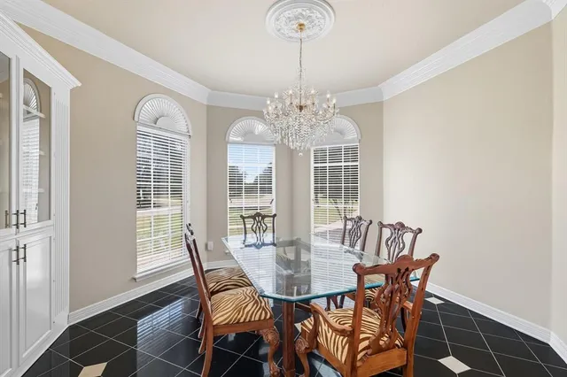 a view of a dining room with furniture and window