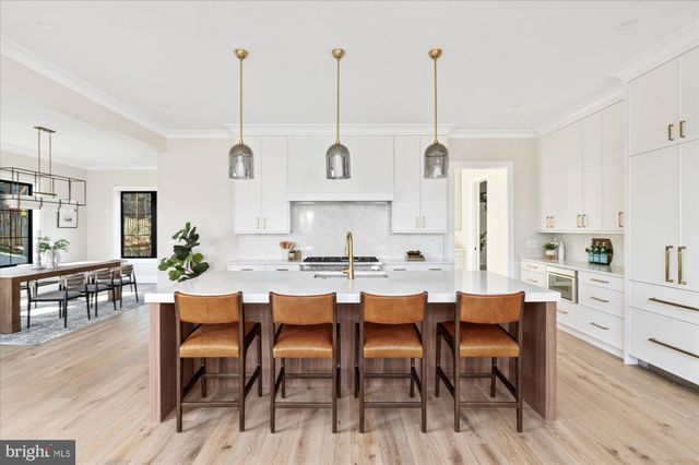 a large living room with stainless steel appliances granite countertop a sink and living room view