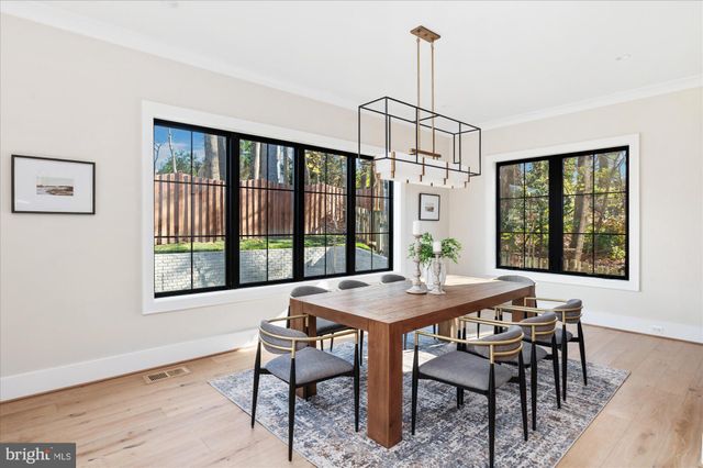 a kitchen with stainless steel appliances a sink and cabinets