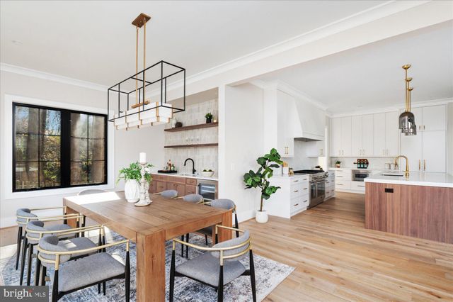 a kitchen with cabinets appliances and a window