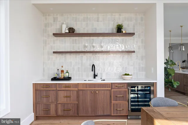 a kitchen with granite countertop a sink and cabinets