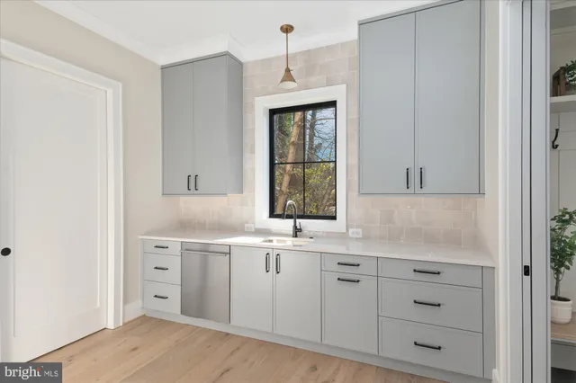 a living room with furniture a table and white walls