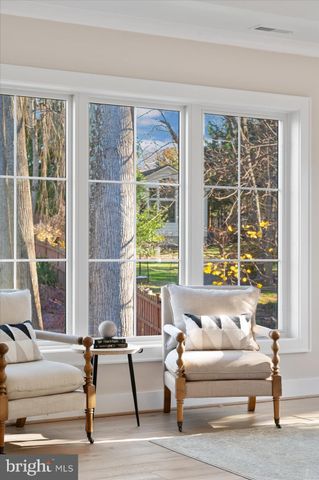 a spacious bathroom with a double vanity sink a mirror a toilet and a window