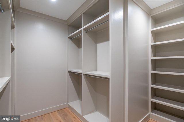 a bathroom with a sink toilet vanity and shower