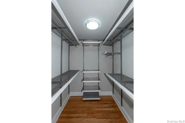 a hallway with with a and white walls