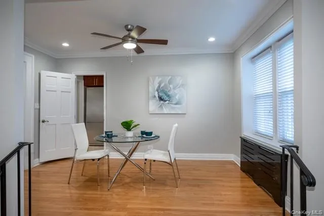 a workspace with wooden floor and a window