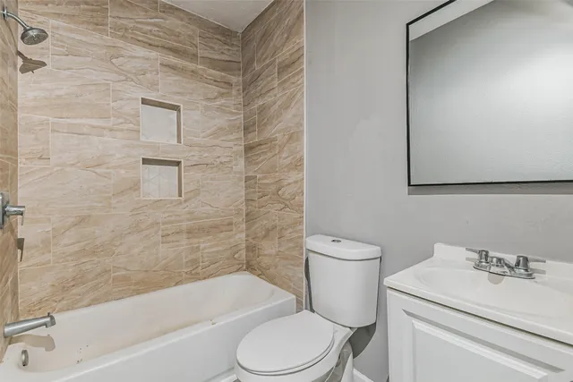 a bathroom with a sink toilet and bathtub