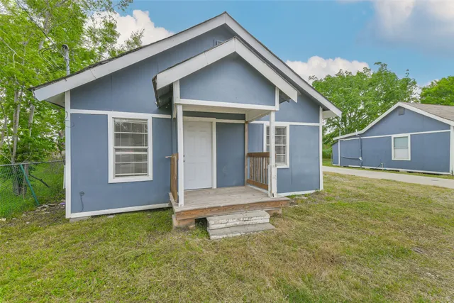 a backyard of a house with seating space