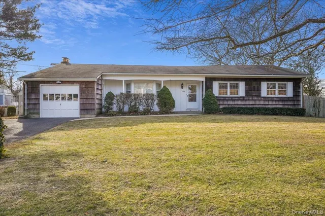 an aerial view of a house with a ocean view