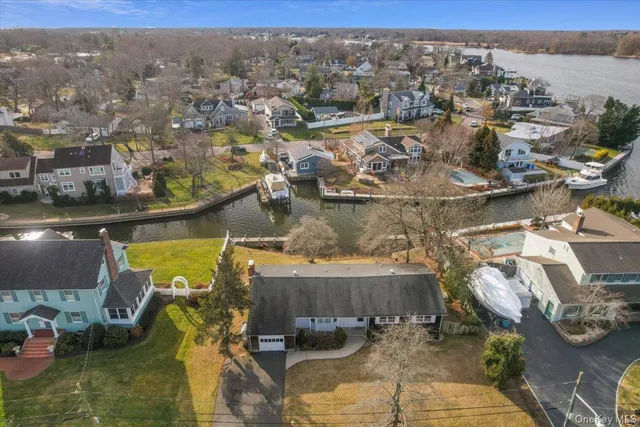 a view of a lake with boats and trees in the background