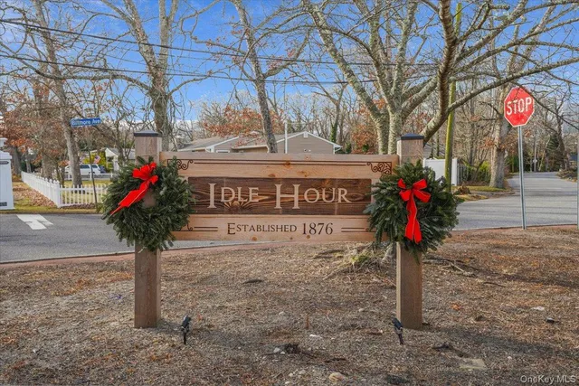an aerial view of a house with a yard and lake view