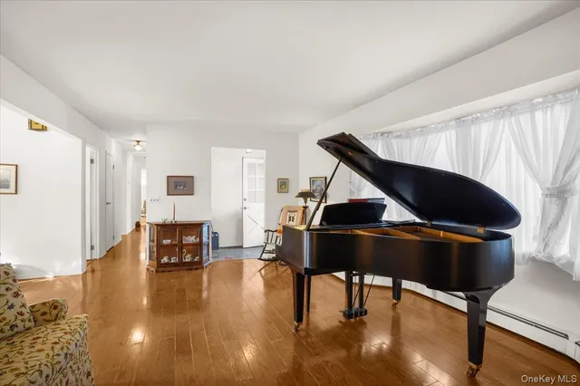 an aerial view of a house with a yard and lake view