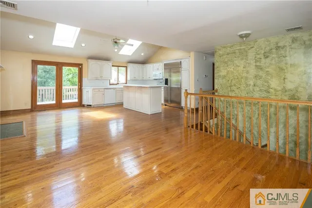 a view of kitchen with furniture and wooden floor