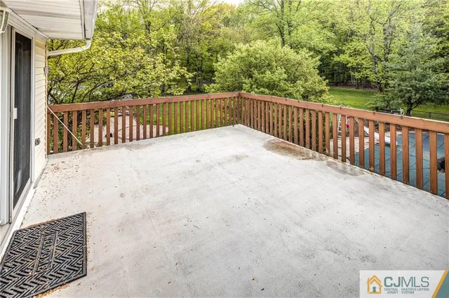 a spacious bathroom with a double vanity sink a toilet and a shower