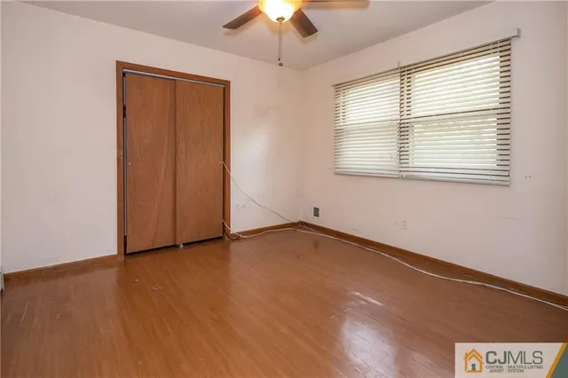 a bathroom with a granite countertop sink a toilet and bathtub