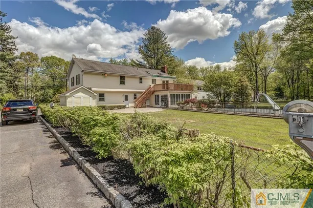 a view of a yard with cars