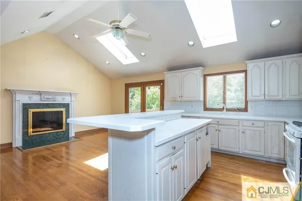 a kitchen with a sink and a fireplace