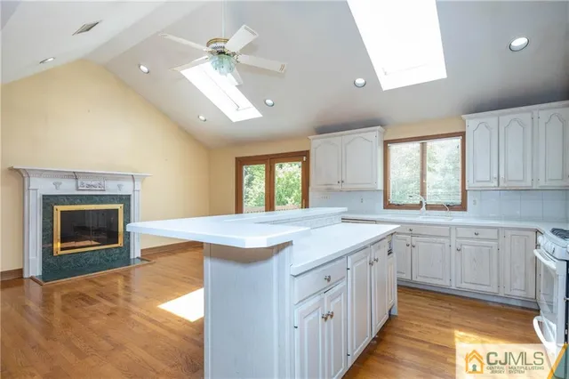 a kitchen with a sink and a fireplace