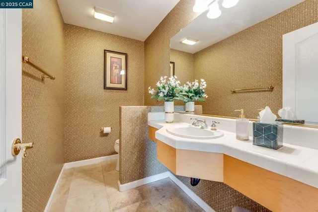 a living room with furniture wooden floor and a fireplace